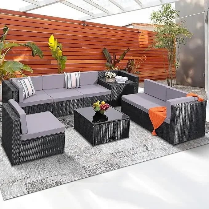 Eight Piece Outdoor Grey Rattan Patio Set With Glass Table And Hidden Storage