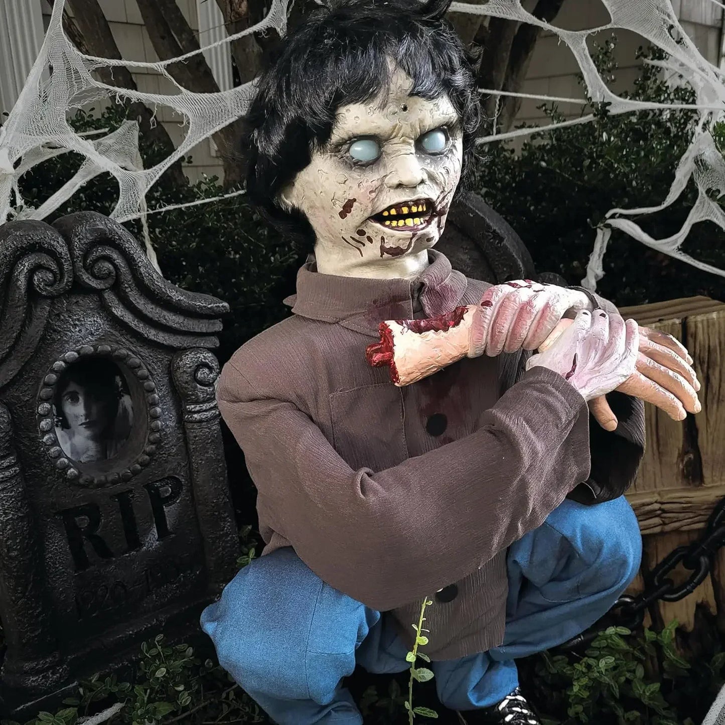Crouching Limb Eater Zombie Boy Halloween Animatronics Motion Activated Indoor Outdoor Display
